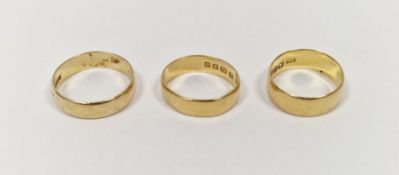 Three 22ct gold wedding bands, combined weight approximately 12.4g