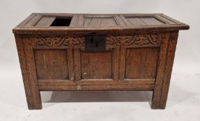18th century oak coffer of rectangular form, the panelled lid opening to reveal large storage area