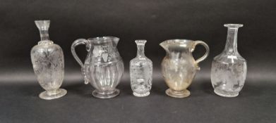 Two engraved glass jugs, one engraved with initials 'FH' above agricultural devices, within ribbon