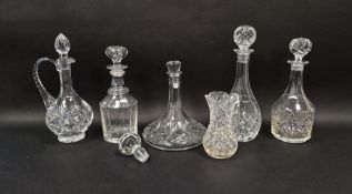 Assorted cut glass decanters, claret jugs and other items including a ships decanter, a claret