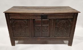 18th century oak coffer, the front with highly carved decoration throughout depicting scrolling
