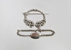 Silver buckle in the form of two snakes, together with a small silver child's bracelet, 39g