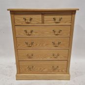 Two similar light oak chests of drawers by The Cotswold Caners, each having two short over four long