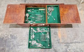 Mid-century stained pine cutlery stand containing a selection of silver-plated flatware, mostly