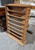 20th century wooden spice rack/cabinet having eight slide-out drawers and four glass-fronted