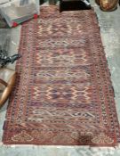 Eastern red ground rug with geometric shape field, multiple geometric borders 205cm x 120cm