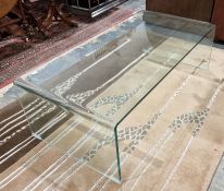 Contemporary glass coffee table of rectangular form, 35cm high x 111cm wide x 55cm deep