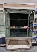 Large partially glazed display cabinet having two glass shelves and a mirrored base, 202cm high x
