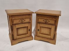 Pair of modern bedside cupboards, each having a single drawer raised over a single door cupboard,