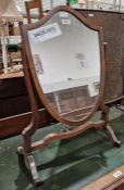 Late 19th/early 20th century mahogany dressing table swing mirror, the mirror itself of shield form,