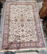 Modern cream ground carpet with central floral medallion on floral field, multiple floral borders