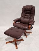 20th century Stressless-style reclining armchair, 101cm high with matching footstool (2)