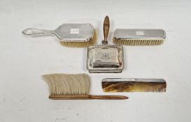 Silver mounted dressing table set, comprising hairbrush, clothes brush and a hair comb, hallmarked