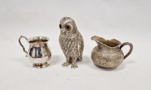 Sterling silver milk jug, decorated throughout with embossed foliate decoration, marked to underside