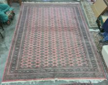 Persian rug, red ground, multi gold in cream and green rectangular lozenge, with multi-border;