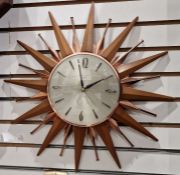 Mid century Metamec starburst wall clock, the silvered dial having baton hour markers with quarterly
