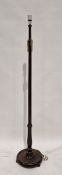 20th century mahogany standard lamp of turned form, mounted on a circular pedestal base, on small