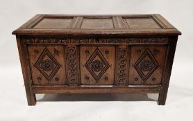 18th century oak coffer, the front panelled with carved floral and circular motifs, 69cm high x