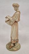 Late 19th century Royal Worcester blush ivory ground figure of a Middle Eastern watercarrier,