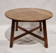 Early 20th century stained oak dining table of circular form, raised on a square tapering base