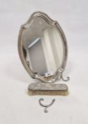 George V silver mounted mirror, of stylised shield form, hallmarked London 1912 by William Comyns,