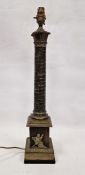 Brass table lamp with foliate terminal, running bird and floral basket design to the column, the