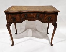 Early 20th century mahogany veneer desk with tooled leather top over one long and two short deep