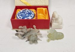 Two Chinese carved green hard stones, carved as a recumbent horse and winged beast and a modern