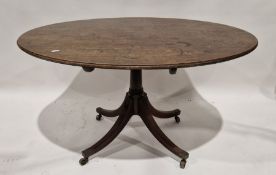 George III mahogany breakfast table of oval form, raised on splayed quadruple supports with metal