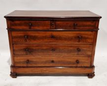 19th century flame mahogany chest of drawers comprising two short over three long drawers, with