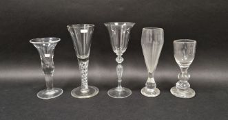 Group of five drinking glasses, comprising: an 18th century-style heavy baluster wine glass with