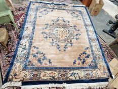 Large cream ground Chinese superwash carpet with centralised floral medallion enclosed by floral