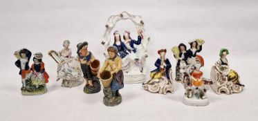 Pair of Goebel pottery bookends in the form of seated piper and his girlfriend, pair of glazed