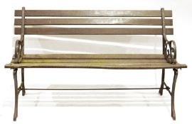 Vintage garden bench with wooden slats and cast iron scrollwork ends, 123cm wide