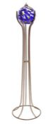 Coloured glass spherical oil lamp on metal stand
