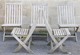 Five folding teak garden chairs with inlaid brass label 'Sky Vision Garden Furniture' (5)