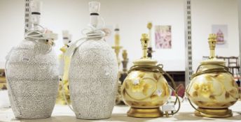 Pair of modern ceramic table lamps with impressed floral decoration, another pair of modern wooden