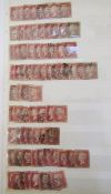 GB: Two red stockbooks of used QV line-engraved imperforate and perforate 1/2d, 1d and 1 1/2d reds