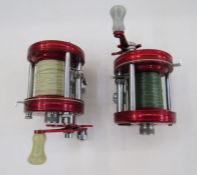 Two Abu Ambassadeur No.6000 reels in red (2).
