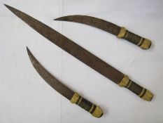 Three early 20th century daggers of Middle Eastern origin.