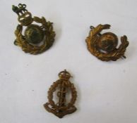 Collection of military cap badges and buttons, together with an Omega watch box.