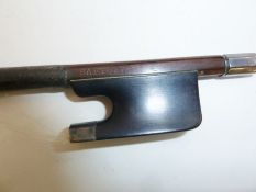 Violin bow having silver mounts and aventurine inlay, stamped 'Sartory', 74cm long.Condition
