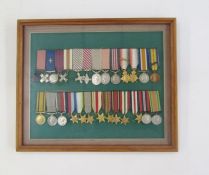 Collection of miniature gallantry medals and campaign medals within glazed frame.