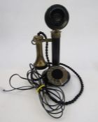 Early 20th century bakelite and brass candlestick telephone with the accompanying bell ringing