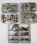Three metal cases of salmon and fly fishing flies.