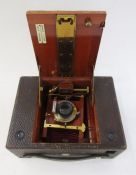 Bell & Howell 200 EE movie camera in brown leather carrying case, an Eastman Kodak folding bellows