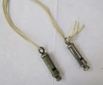 WWII Air Raid precautions whistle, with a second dated 1939. Both made by J Hudson and Co of