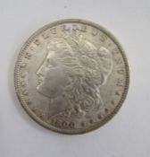 United States 1900 Morgan Dollar, very fine, with two Kennedy Half Dollars 1967 & 1968