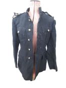 Two 1949 pattern battle dress tunics and trousers, officer in the East Anglia regiment, officer's