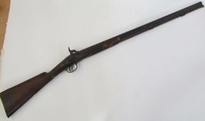 A 19th century percussion rifle with walnut and brass stock, complete with ram-rod.